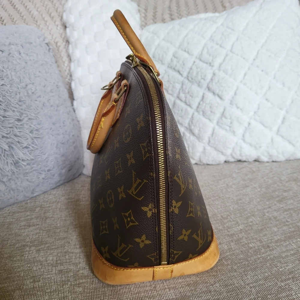 Authentic Louis Vuitton Monogram Alma PM Hand Bag..